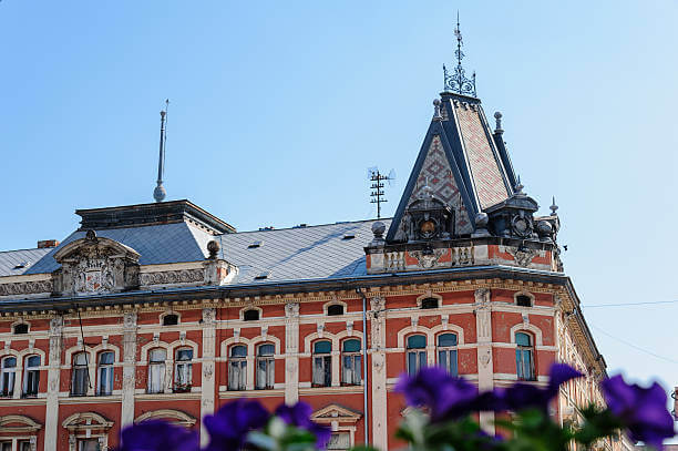 Close-up of the Andrassy Palace facade and roof on main street